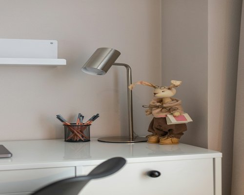 A well-lit desk area focusing on correct posture and distance